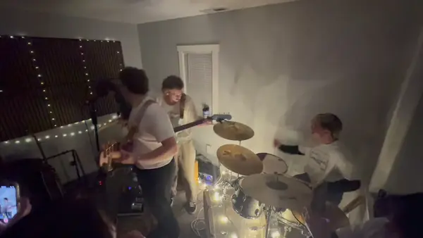 DogPaw playing a packed living-room house show in north Provo
