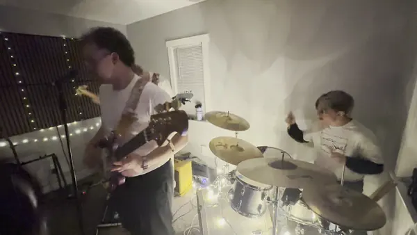 DogPaw guitarist and drummer squeezed into a north Provo living room