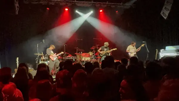 Crossing stage lights over DogPaw and the crowd at The Depot