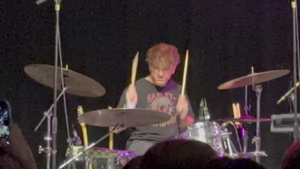 DogPaw drummer mid-beat at The Depot